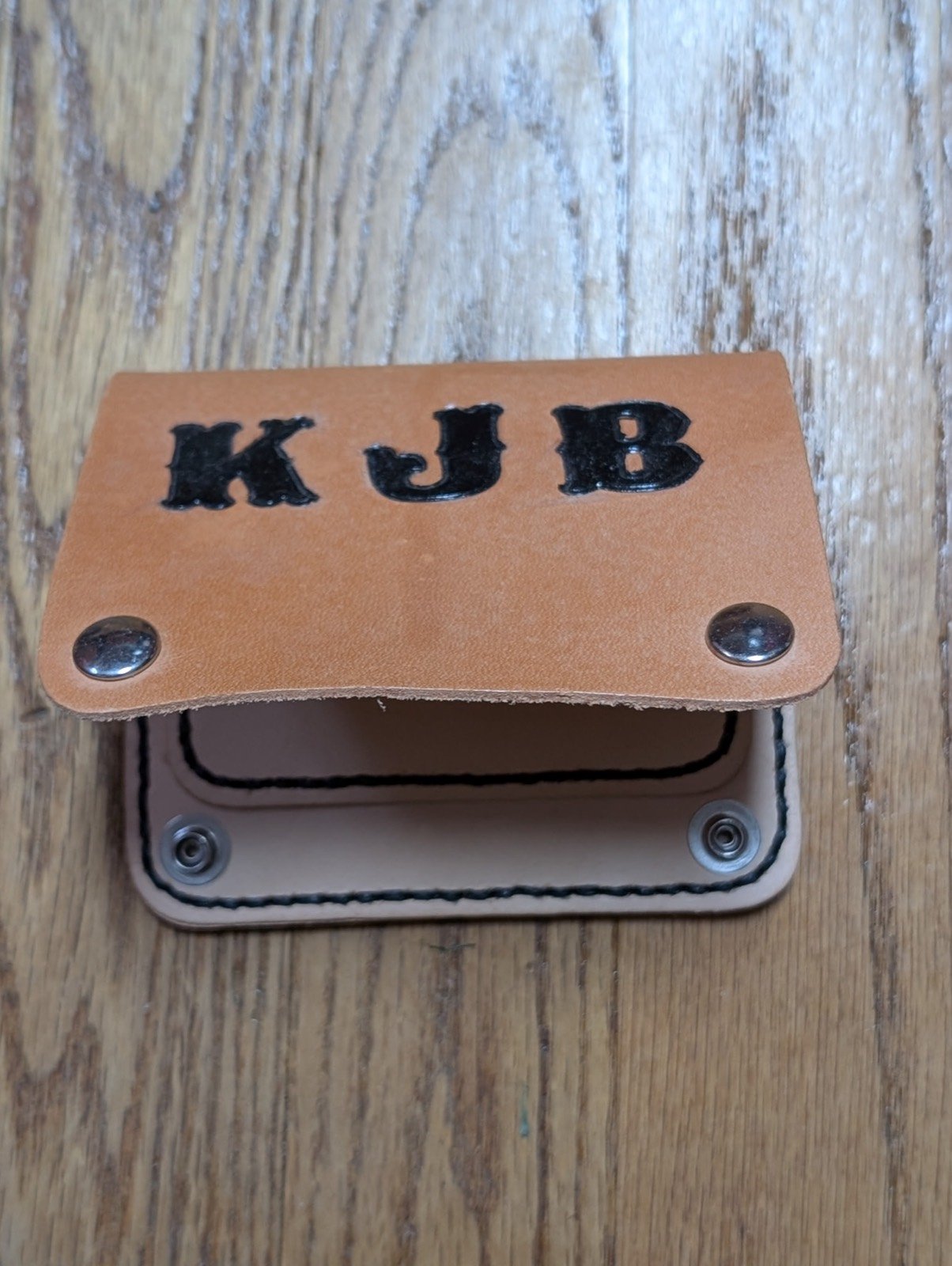 Leather pouch hand-tooled with the initials K J B